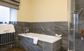 Take a bubble bath in The Eskeleth bathroom at The Burgoyne Hotel